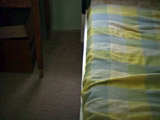 bed with check bedspread